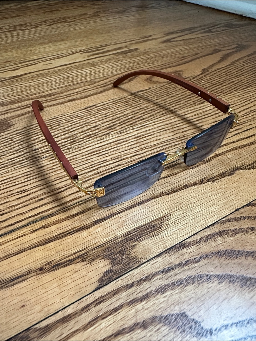 Cartier Rimless Sunglasses with Blue Gradient Lenses and Gold Accents - Picture 2 of 14